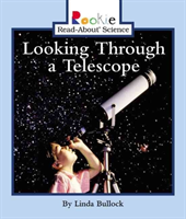 Looking Through a Telescope (Rookie Read-About Science: Physical Science: Previous Editions)